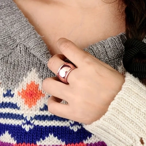 Minimalist wide rose gold polished copper ring for men and women worn by model