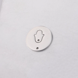 Detailed view of a silver mirror-polished Hamsa hand pendant charm for DIY jewelry making