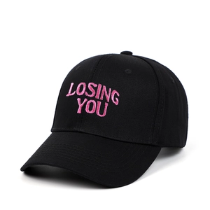 Black cotton baseball cap with LOSING YOU pink embroidery in a classic six-panel design