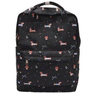 Detail of a black graffiti backpack featuring colorful dachshund dog prints and dual handles