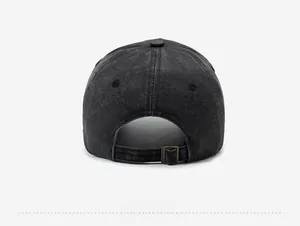 Detail view of washed denim baseball cap back with adjustable metal buckle and strap