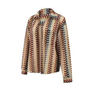 Detail view of multicolored wave-patterned knit fabric on long-sleeve collar shirt