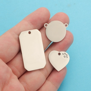 Polished stainless steel DIY charms in rectangular, circular, and heart shapes