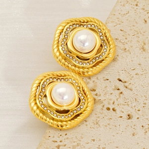 Vintage gold stud earrings with white pearl center and sparkling zircon halo design