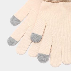 Detail of knit gloves with touchscreen-sensitive fingertips and striped cuffs