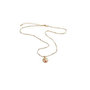 Close-up of gold chain featuring winking smiley face pendant with zircon and lobster clasp