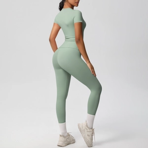 Detail view of the seamless light green high-waist yoga pants and short sleeve top set