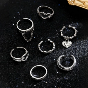 Detail of 7-piece vintage silver gothic ring set featuring spiders and snake motifs