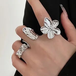 Three-piece silver irregular flower and pea pod ring set for women, worn on hand