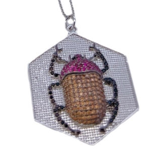 Exquisite beetle pendant with red and brown gemstones on silver hexagonal base with chain