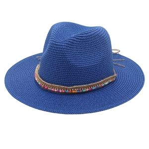 Detail of dark blue Panama hat with colorful beads, silver rhinestones and tassel accents