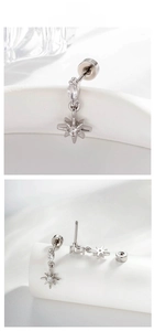 Macro view of star pendant earrings with screw-back design and shiny crystals