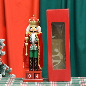 Nutcracker King with red cape and calendar base 04 in festive Christmas packaging