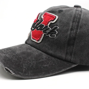 Macro detail of New York embroidery and distressed fabric on a vintage cotton baseball cap