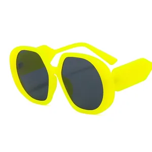 Oversized neon yellow fashion sunglasses with bold frames and dark lenses for women