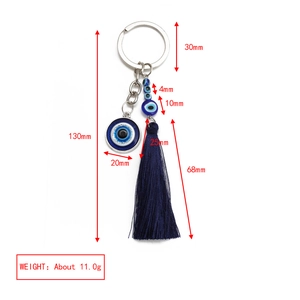 Detailed view of evil eye keychain with blue tassel and dimensions 130mm total length