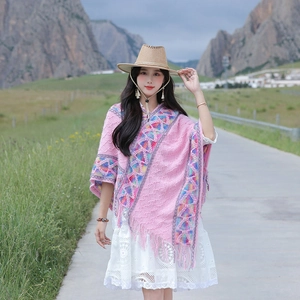 Ethnic style pink knitted poncho with geometric patterns and fringe for outdoor travel wear