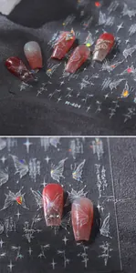 Detail of M-404 butterfly nail stickers with aurora laser effect on dark gradient nails