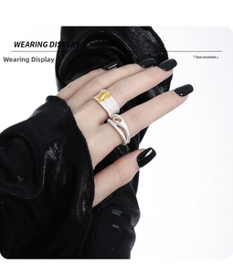 Wearing display of S925 silver textured rings with gold plating and amber gemstone detail
