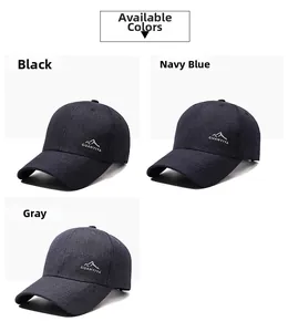 Detail view of cotton baseball caps in black, navy, and grey with mountain embroidery