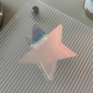 Iridescent star-shaped acrylic hair claw clip with a glossy holographic finish