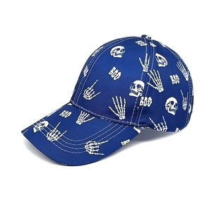 Detail of navy blue baseball cap with white skull and bone hand prints and BOO text