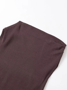 Close-up of dark brown ribbed knit top showing neckline detail and fabric texture