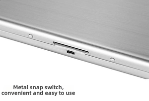 Close-up of the stainless steel card holder showing the brushed metal and snap closure