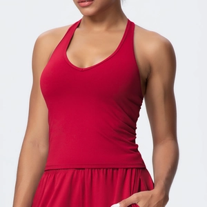 Detail showing red quick-dry athletic set with V-neck sports bra and matching gym shorts