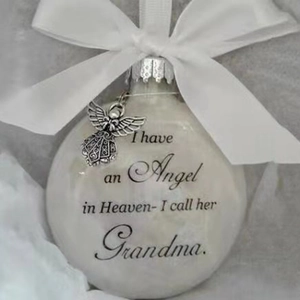 Close-up of Memorial Grandma ornament with white feathers and silver angel charm