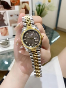 Close-up of women's two-tone steel watch featuring grey dial and diamond markers