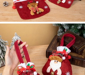 Detail of Christmas candy gift bag with 3D Santa Claus, reindeer, and golden bell detail