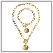 Detailed shot of golden flower chain jewelry set featuring T-bar clasp and round pendant