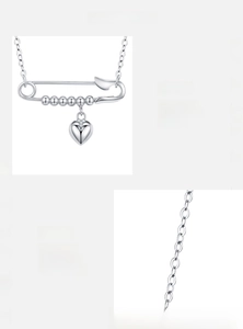 Detail showing polished S925 sterling silver paperclip heart pendant and O-chain necklace