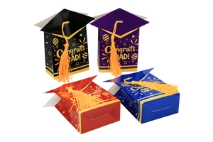 Detail view of graduation cap gift boxes in four colors with gold tassels and congrats text