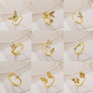 Set of gold butterfly rings with cubic zirconia and enamel in adjustable open design