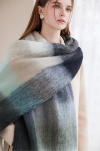 Detailed texture of thick multi-color gradient winter scarf with soft fringed material