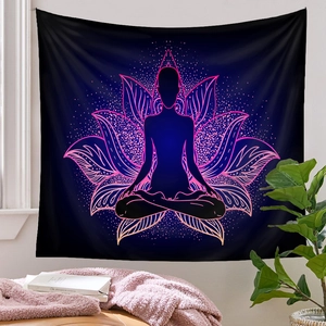 Detail view of yoga tapestry featuring a meditator silhouette and lotus on a cozy white wall
