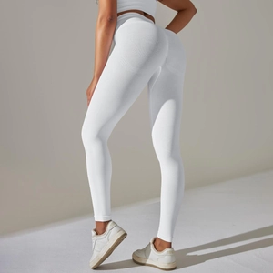 Close-up of seamless white high-waist yoga leggings showing elastic texture and lifting effect
