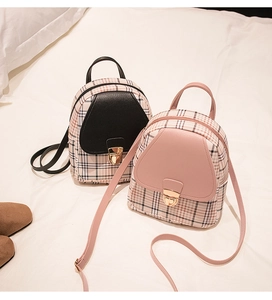 Detail of mini plaid PU leather backpacks with golden locks in black and pink colors