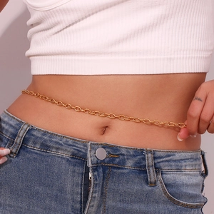 Detail shot of a stylish 18K gold-plated stainless steel waist chain worn on jeans
