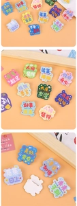 Detailed view of creative acrylic pins with motivational quotes and metal safety clasp