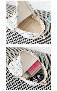 Detailed internal view of floral canvas backpack showing spacious compartments and capacity