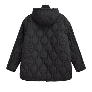 Detail view of gourd-quilted back on black hooded puffer jacket with matte finish