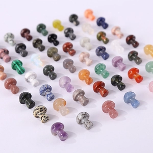 Assorted natural crystal mushroom stone carvings in multiple colors on white background