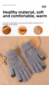Detail of grey winter knit gloves showing touch screen fingertips and warm fleece lining