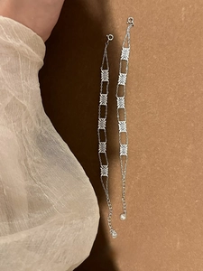 Detail shot of vintage silver hollow daisy bracelet with spring clasp and extension chain