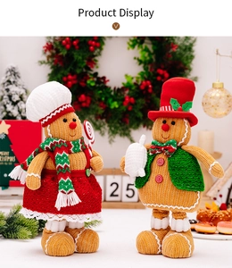 Close-up of knit Gingerbread Man dolls with festive hats and scarves for Christmas decor