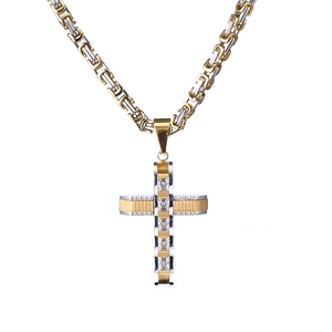 Detail des Kreuzanhängers in Gold und Silber mit rechteckigen Zirkonia-Steinen