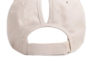 Detail of khaki ponytail baseball cap showing adjustable velcro strap and cotton twill texture